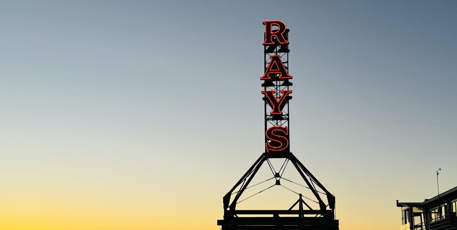 Ray's red neon sign at Sunset over Shilshole Bay
